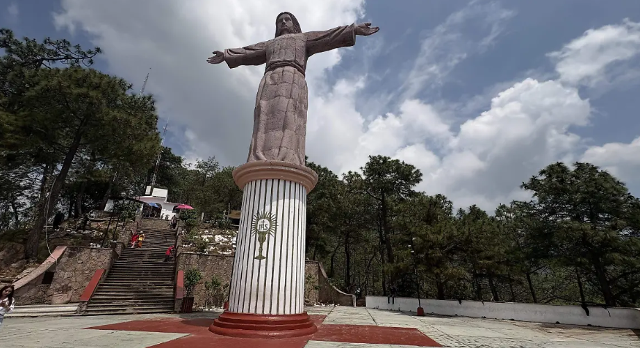 Taxco on vacation: a monumental Christ statue, a cable car, and caves to explore.